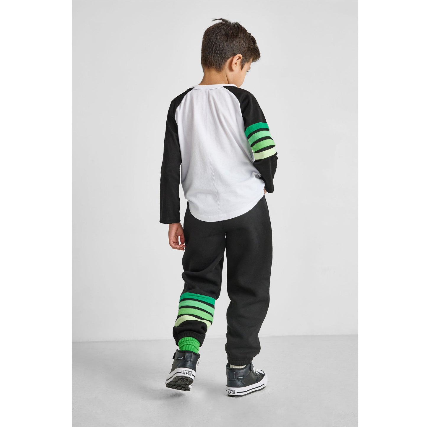 back view of our eco-friendly dinosaur baseball tee and green striped joggers