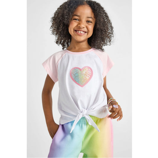 girl wearing our sustainable heart knotted baseball tee with rainbow wide-leg joggers