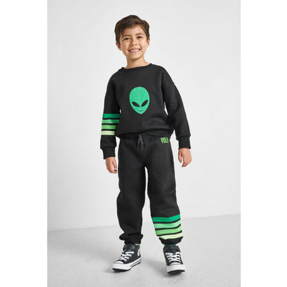 boy wearing our eco-friendly alien sweatshirt and matching green striped joggers