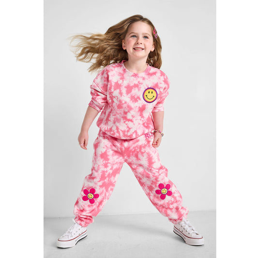 Girl wearing our sustainable Smiley Tie-Dye Crewneck Sweatshirt and Smiley Tie-Dye Joggers