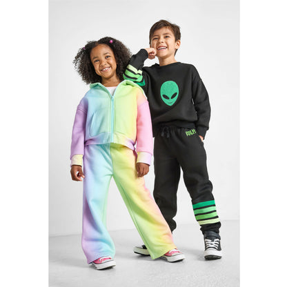 girl wearing our eco-friendly rainbow set and boy wearing our alien set