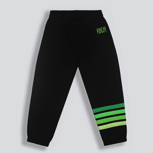 Sustainable, comfortable, and fun black sweatpants for children with a green 'RBLM' logo near the left hip and four horizontal green stripes on the lower left leg, shown against a light gray background.