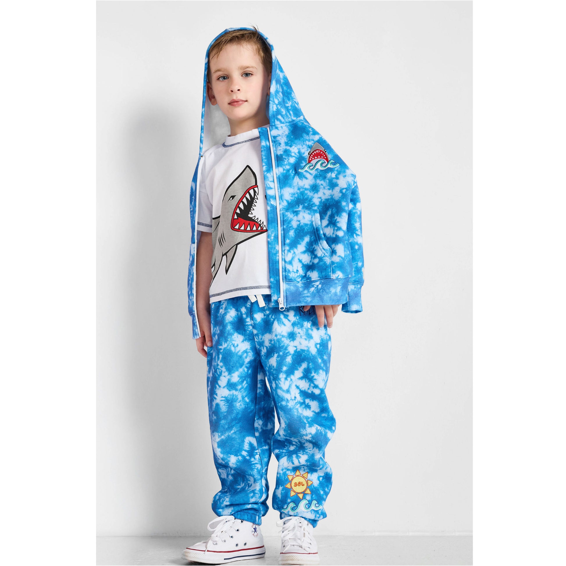 boy wearing our sustainable blue tie-dye shark set