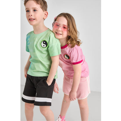 A boy and girl wearing recycled polyester and organic cotton pink and green tie-dye tees.