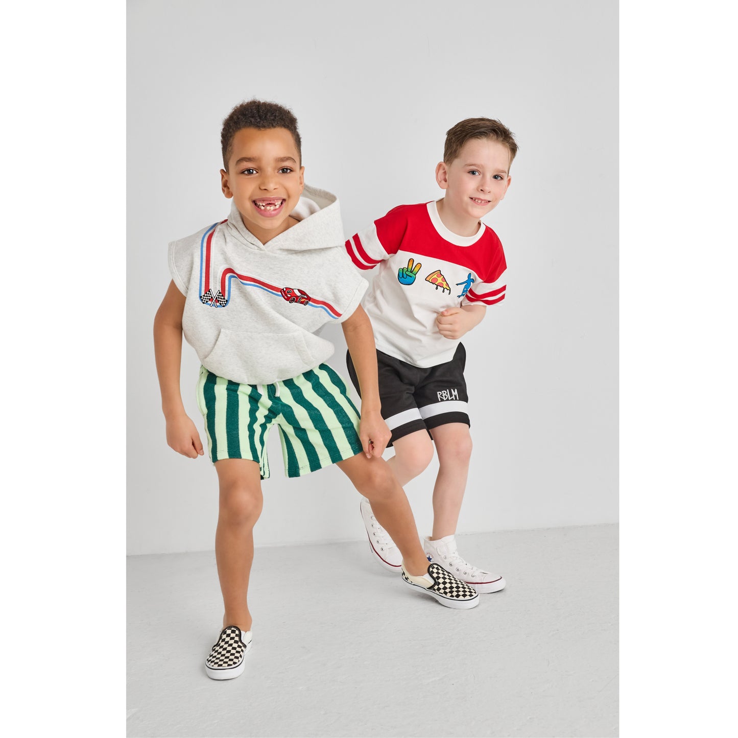 Boys playing and wearing sustainable, colorful outfits