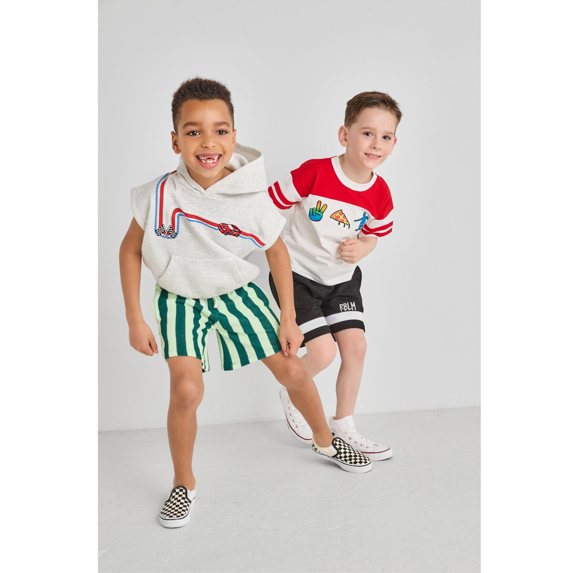 Boys playing and wearing sustainable, colorful outfits