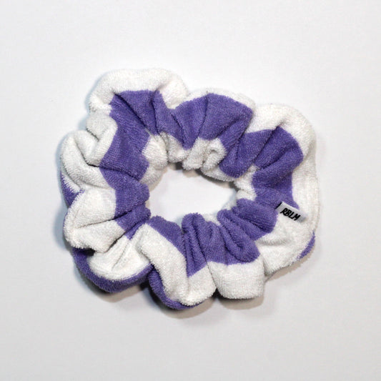 Purple and white scrunchie on a light gray background