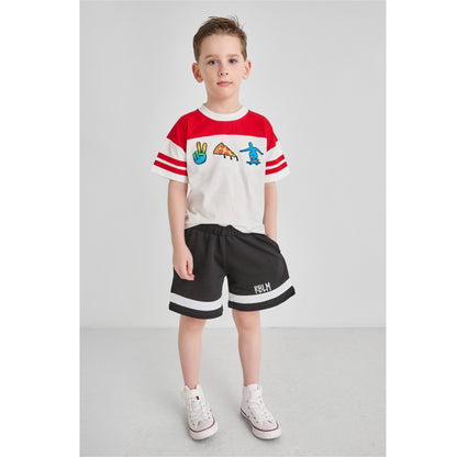 Child wearing an eco-friendly red and white t-shirt with embroidered graphics, and black shorts.