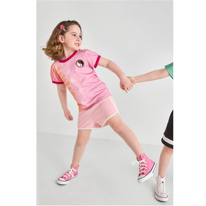 Girl wearing a sustainable, pink toddler summer outfit 