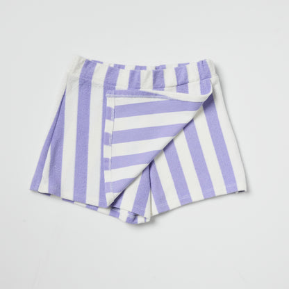 Sustainable kids folded purple and white striped skort on a light gray background