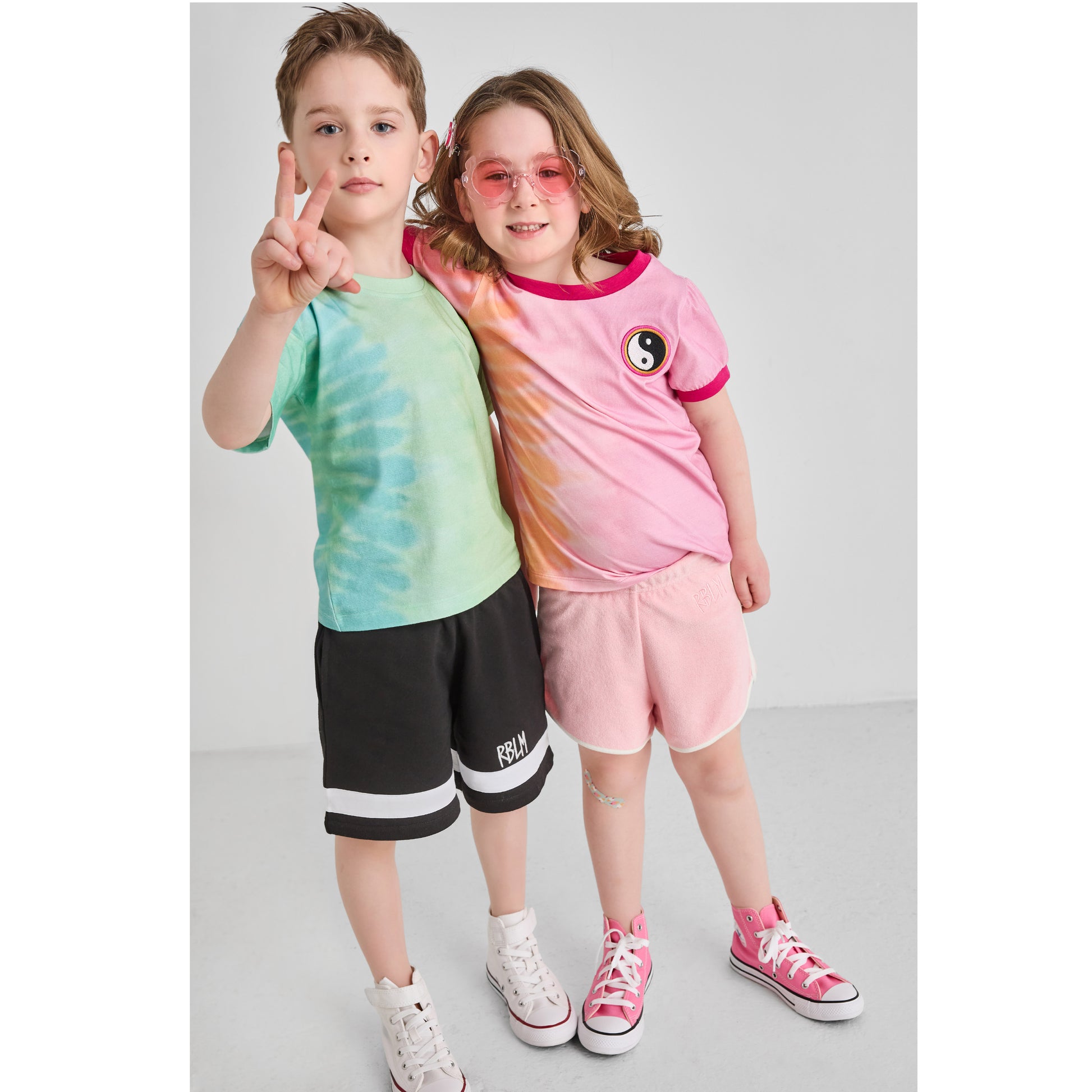 Children wearing retro, colorful, fun, eco-friendly summer outfits 