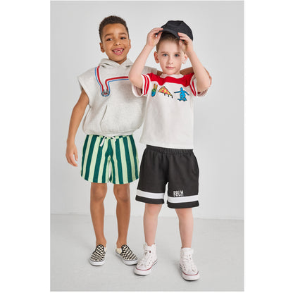 Boys wearing colorful, fun, and sustainable outfits.