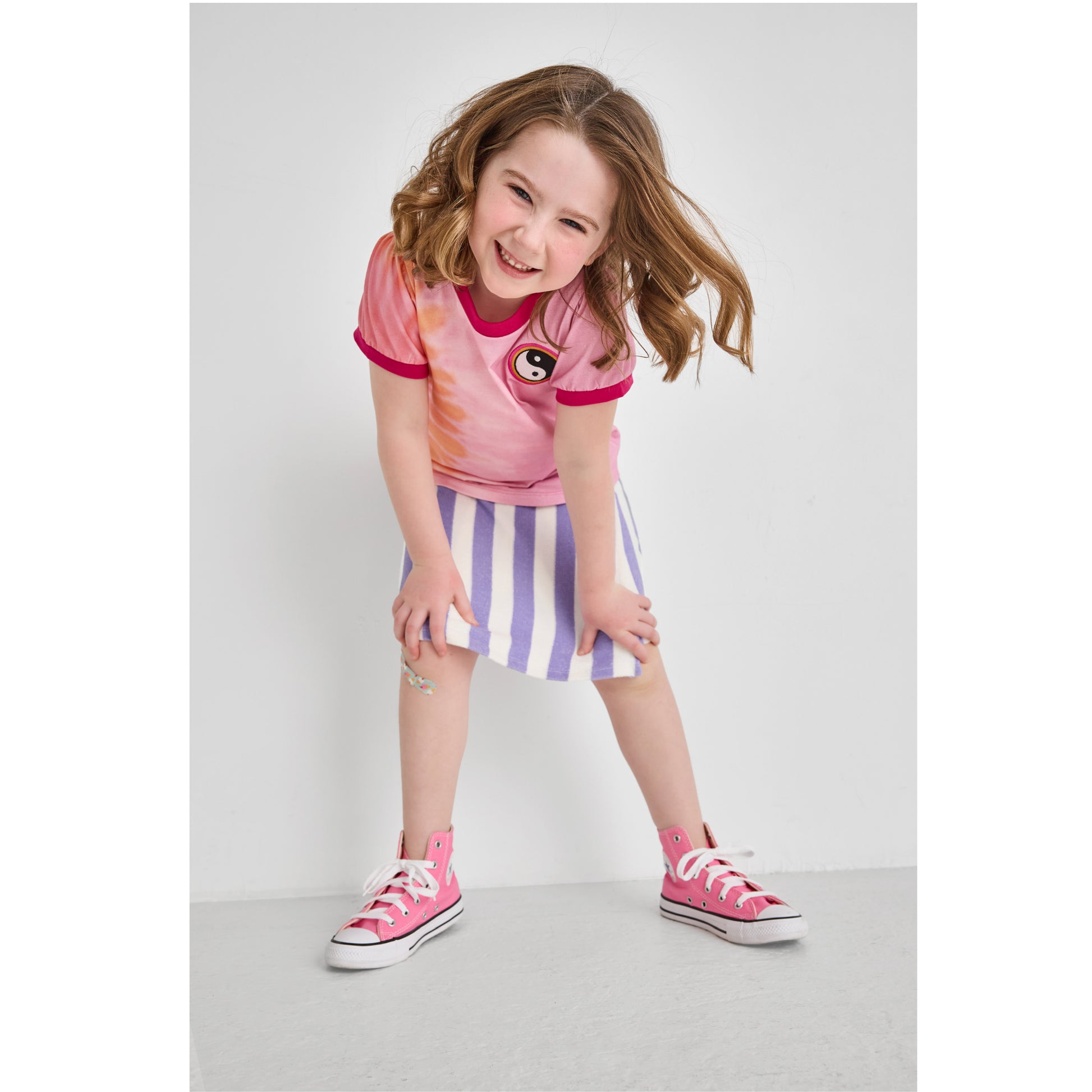 A girl wearing a cute, sustainable outfit for summer