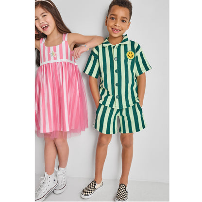 Girl and a boy wearing colorful, fun, sustainable outfits