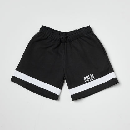 Eco-friendly kids black shorts with a white stripe on a white background