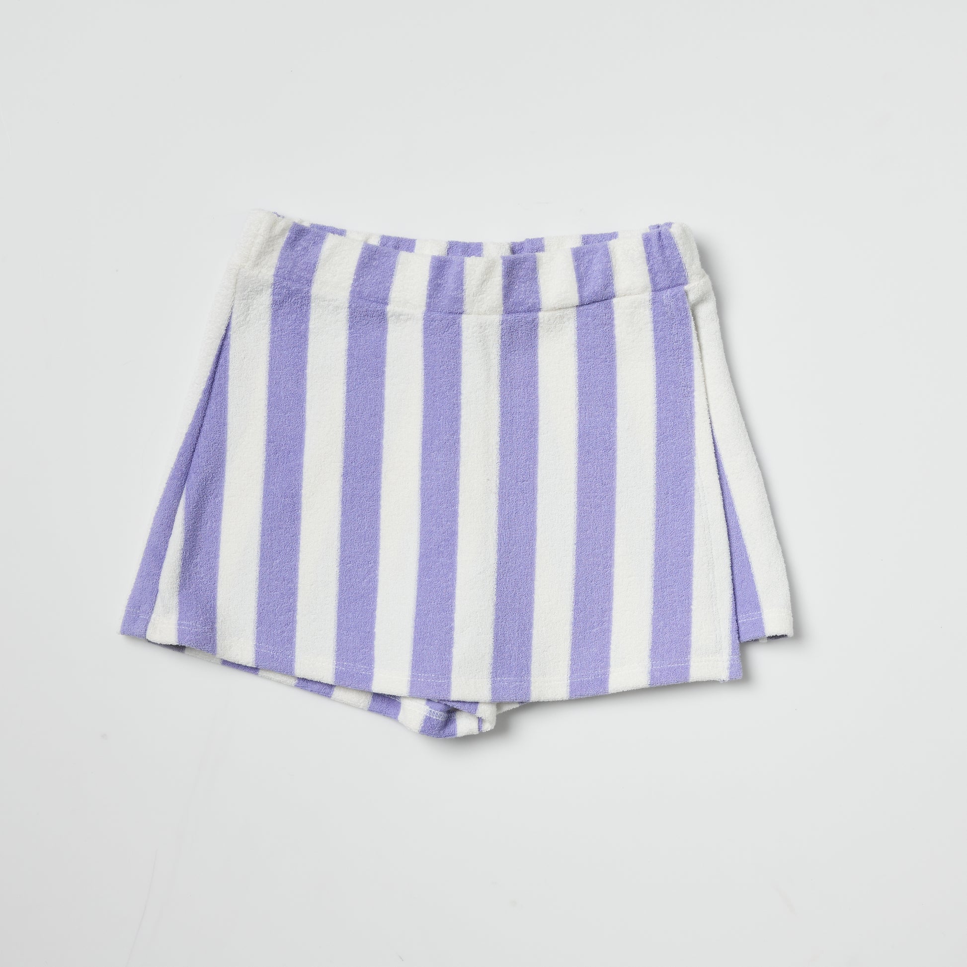 Sustainable kids purple and white striped skort on a light gray background
