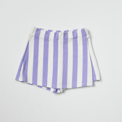 Sustainable kids purple and white striped skort on a light gray background