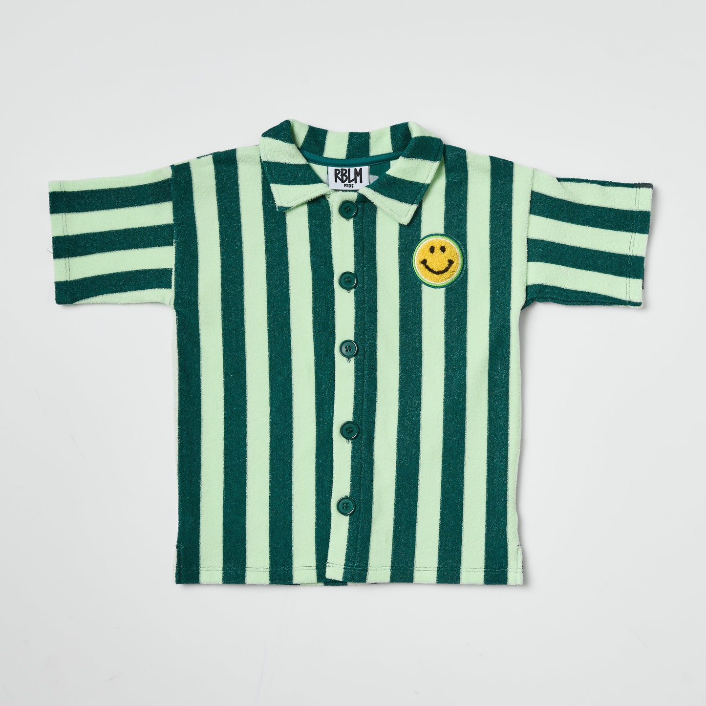 Eco-friendly kids green-striped shirt with a smiley face patch on a light gray background
