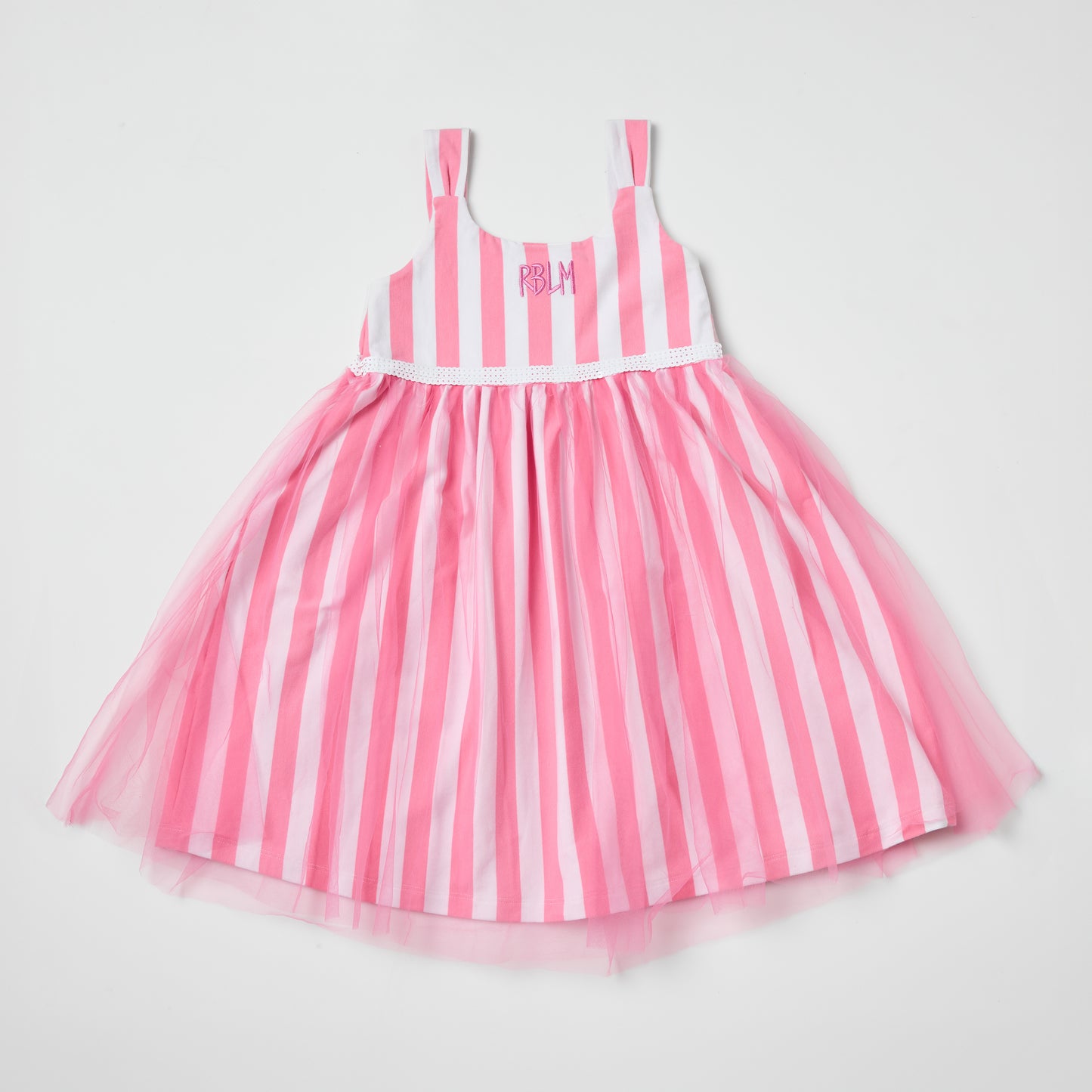 Sustainable kids pink and white striped dress with a tulle skirt on a light gray background