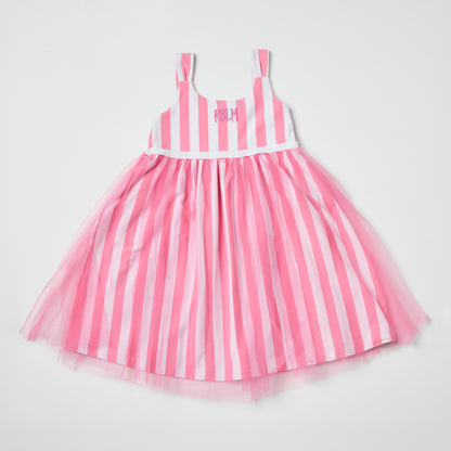 Sustainable kids pink and white striped dress with a tulle skirt on a light gray background