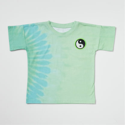Sustainable kids green tie-dye t-shirt with an embroidered yin yang on a white background